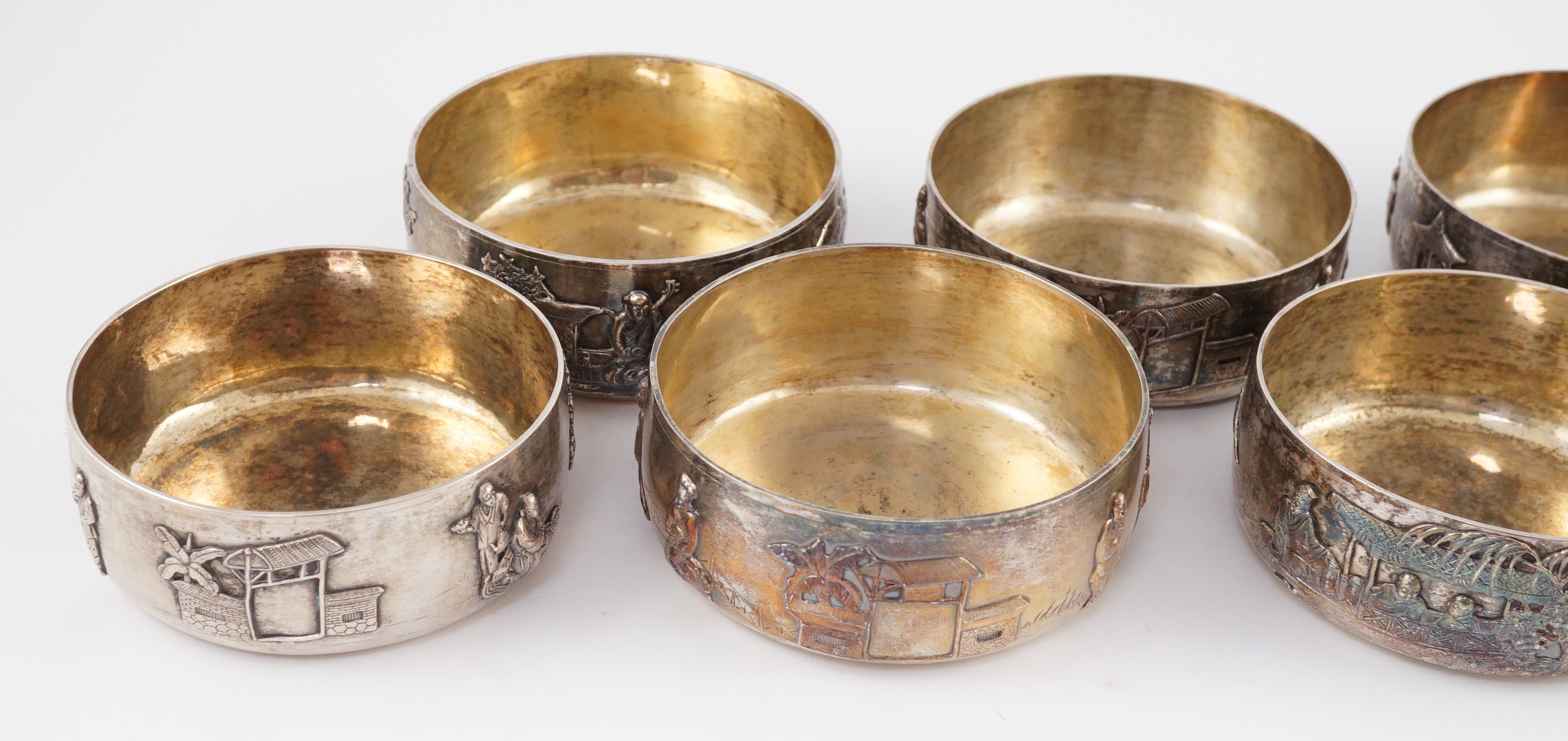 A set of four Chinese Export silver finger bowls, by Wang Hing, Hong Kong and one other set of four Chinese Export silver finger bowls